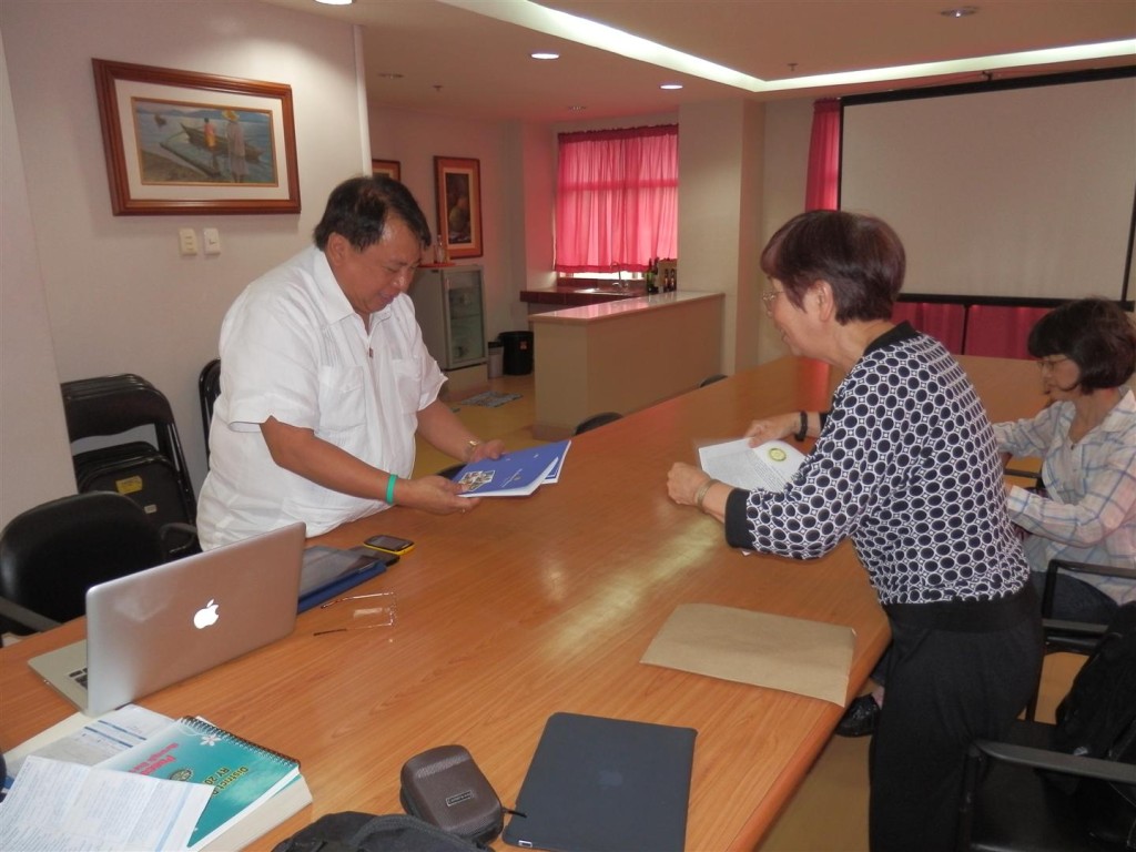 Cavite, Philippines – Tanaka Book Presentation Feb. 2013 MM Rotarians Yoshiko, Kimiyo, Casey presenting books to DG Mercado