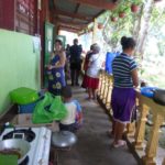 Preparing food in shaded overhangs