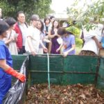 Mulch bin filled with leaves soaked in trash can